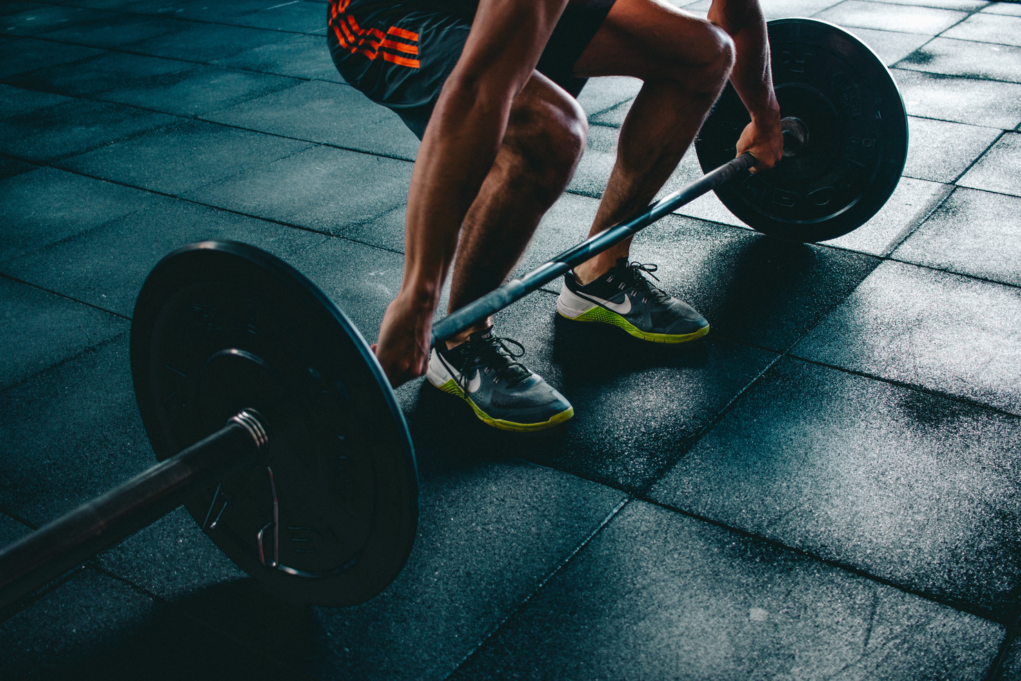 Person lifting weights at the gym for personal growth